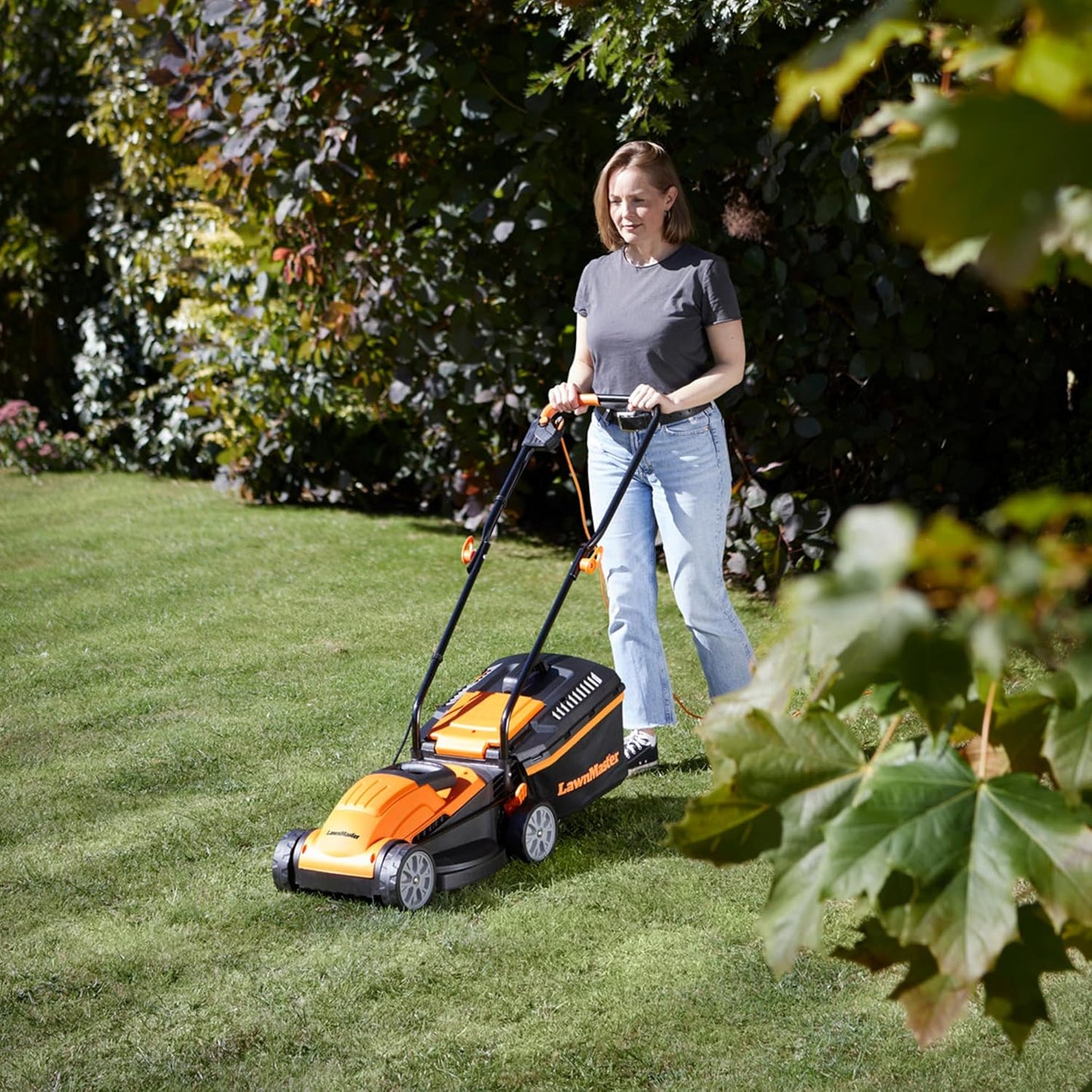 LawnMaster 1200W Electric Lawn Mower with 32cm cutting width, ideal for small lawns. With 5 adjustable cutting heights and rear roller for striped finish, 2 year guarantee